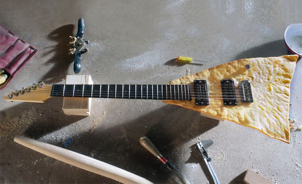 Thumb tortilla chip guitar